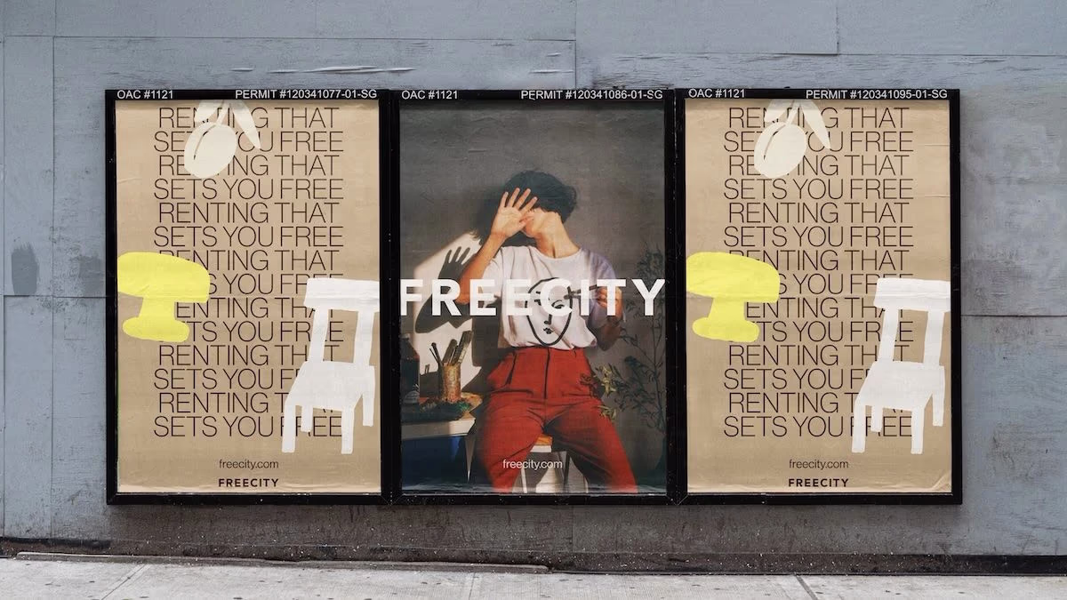 Three posters on a city wall for the FreeCity campaign: two with the line “Renting that sets you free” and one showing a person shielding their face from the sun, with the FreeCity name across it.